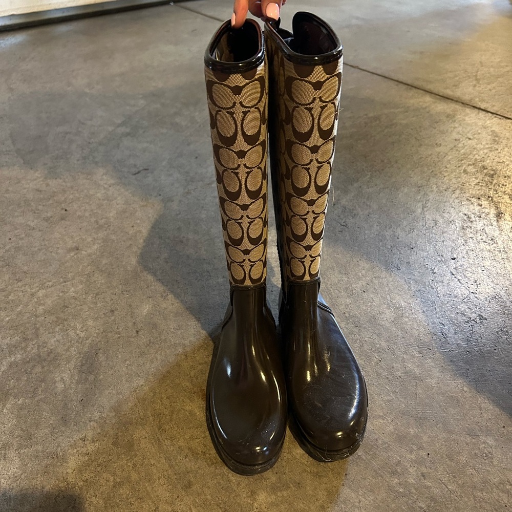 Coach tall tie up boots.